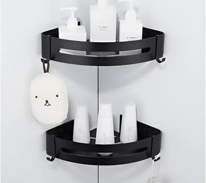 Black two-tier corner shelf with sleek modern design and rounded edges in decorbites brushed gold aluminum finish