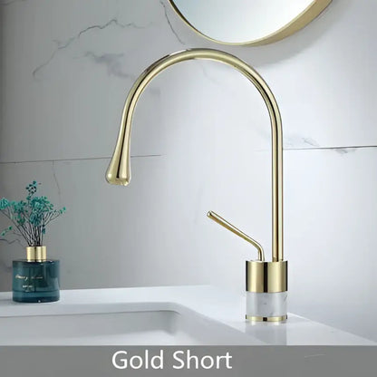 Modern brushed gold brass bathroom sink faucet with a sleek curved spout and minimalist design in brushed gold finish