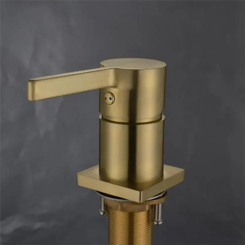 Modern brushed gold basin faucet soap dispenser with sleek cylindrical body and square base by decorbites brushed gold
