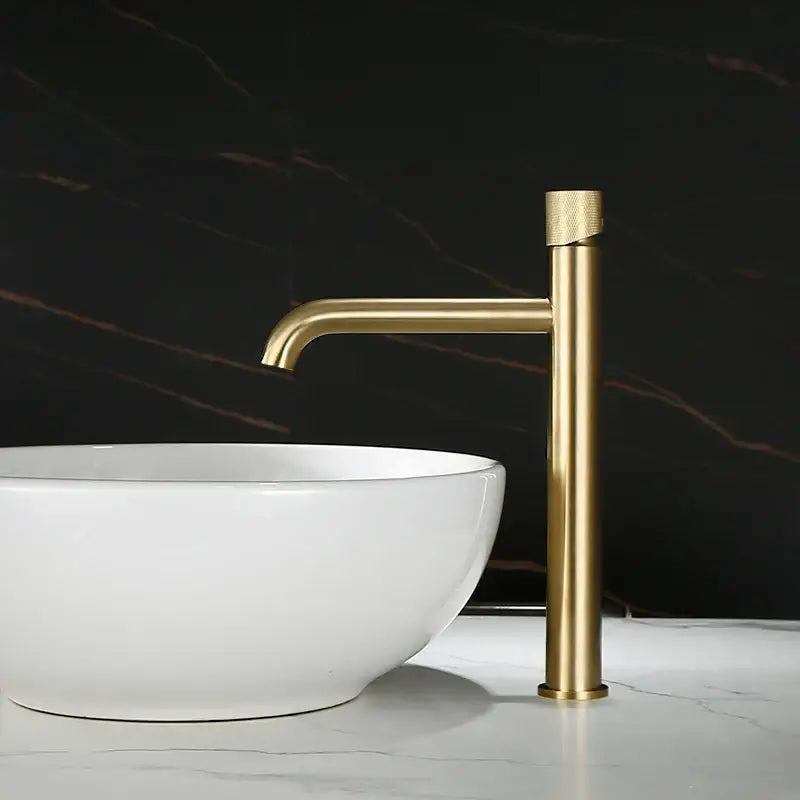 Modern brushed gold basin faucet with textured cylindrical handle and sleek curved spout by decorbites brushed gold