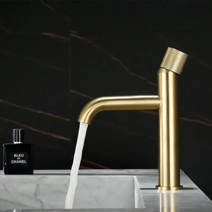 Modern brushed gold basin faucet with textured knurled handle and sleek cylindrical spout by decorbites brushed gold