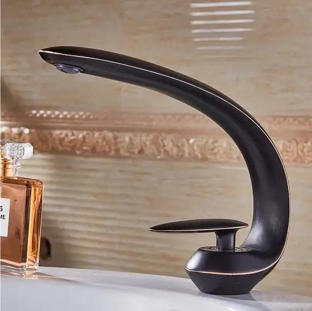 Modern black matte basin faucet with sleek curved design and single handle for bathroom sink decorbites brushed gold style