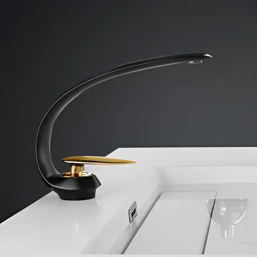 Modern brushed gold basin faucet with sleek curved design in black and gold for bathroom sink decorbites brushed gold