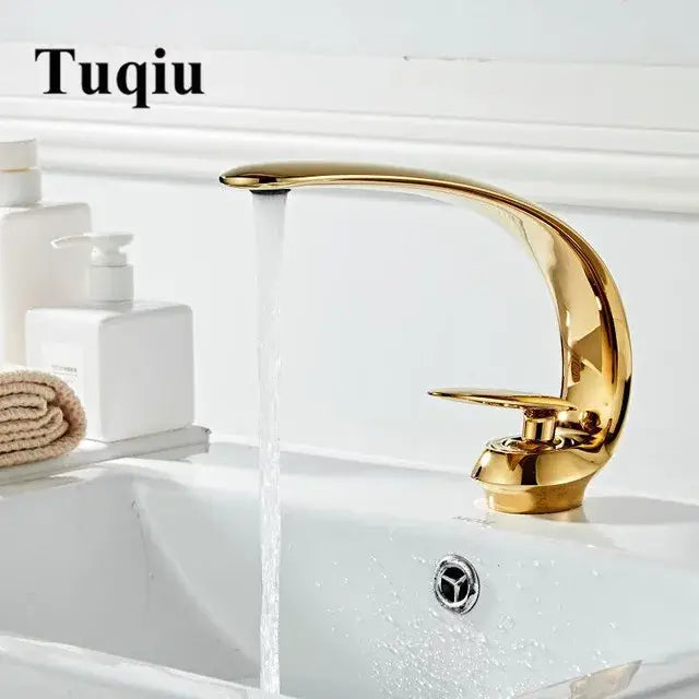 Modern brushed gold basin faucet with a sleek curved spout in decorbites brushed gold bathroom sink fixture design