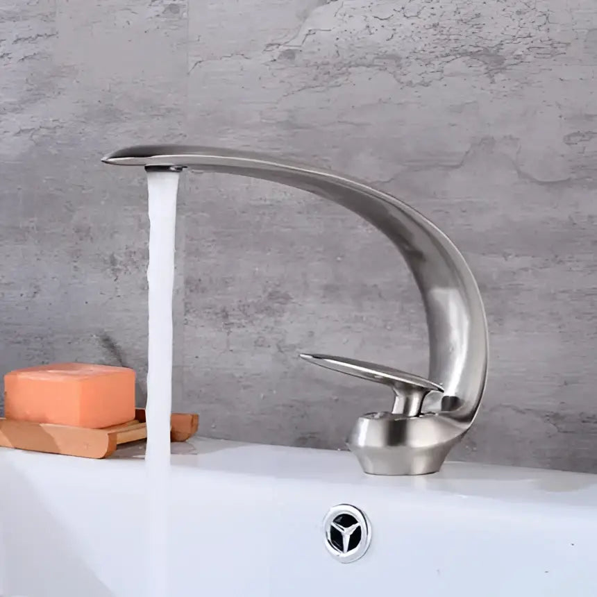 Modern brushed gold basin faucet with sleek curved design and single handle by decorbites brushed gold style