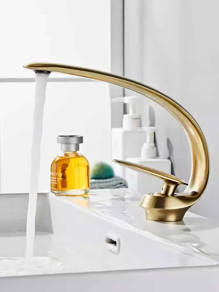 Modern brushed gold basin faucet with sleek curved design in brushed gold ideal for bathroom sink decorbites brushed gold