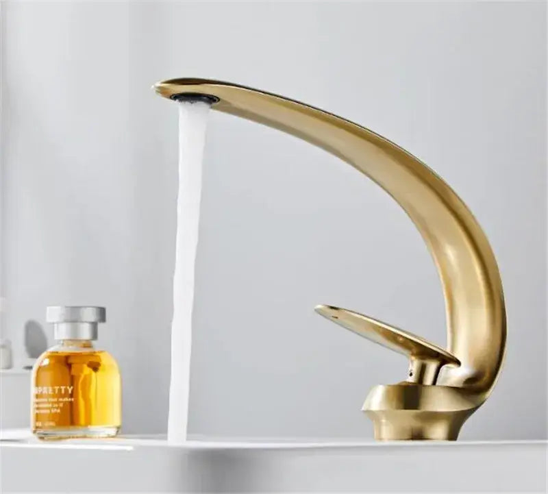 Modern brushed gold basin faucet with sleek curved design in decorbites brushed gold finish for bathroom sink fixture