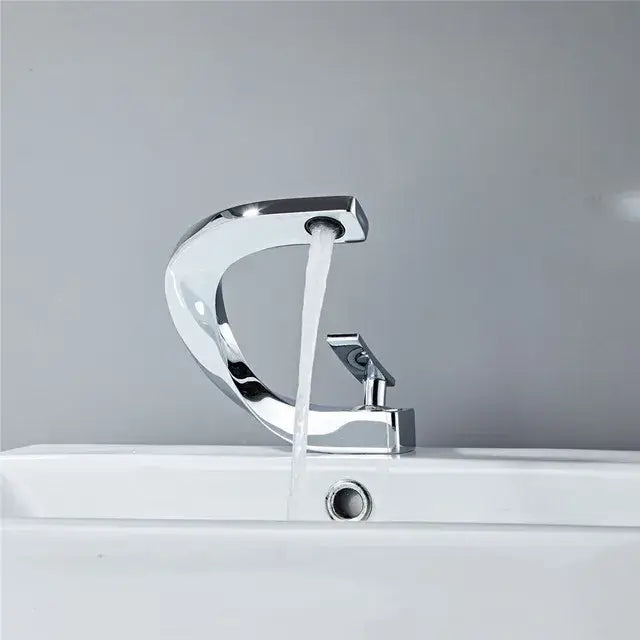 Modern chrome finished basin faucet with sleek curved design and single handle by decorbites basin faucet collection