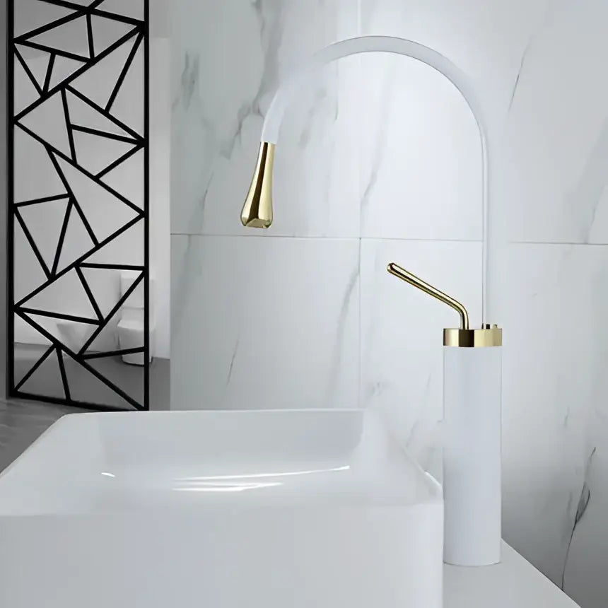 Modern brushed gold basin faucet with arched design and matching cylindrical base ideal for decorbites brushed gold kitchens