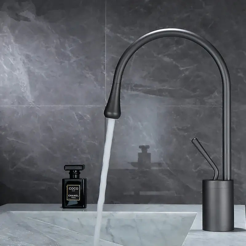 Modern brushed gold basin faucet with sleek curved spout and cylindrical base for bathroom decorbites brushed gold style