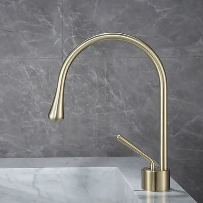 Modern brushed gold basin faucet with brass finish featuring a sleek curved spout for kitchen use by decorbites brushed gold