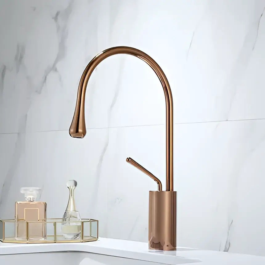 Modern brushed gold basin faucet with copper finish sleek curved spout and cylindrical base by decorbites brushed gold