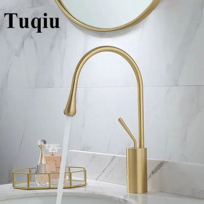 Modern brushed gold basin faucet with sleek curved swivel spout and cylindrical base by decorbites for bathroom use