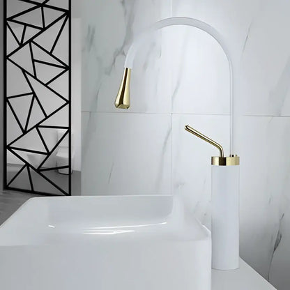 White ceramic sink with a modern brushed gold basin faucet and matching swivel spout by decorbites in bathroom decor