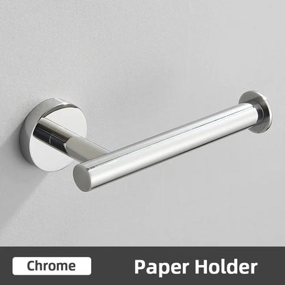 Chrome finished toilet paper holder with sleek cylindrical design in modern brushed gold bathroom accessories set stainless steel bathroom