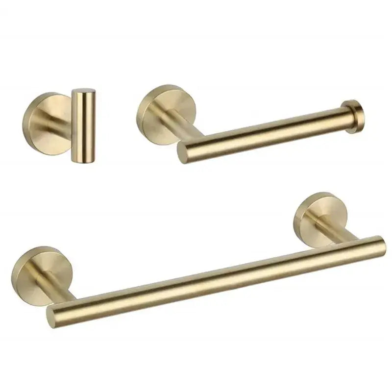 Modern brushed gold bathroom accessory set featuring brushed gold towel bar toilet paper holder and wall-mounted knob