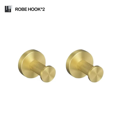 Two sleek gold-finished robe hooks with textured grip and circular plates in a decorbites brushed gold bathroom set