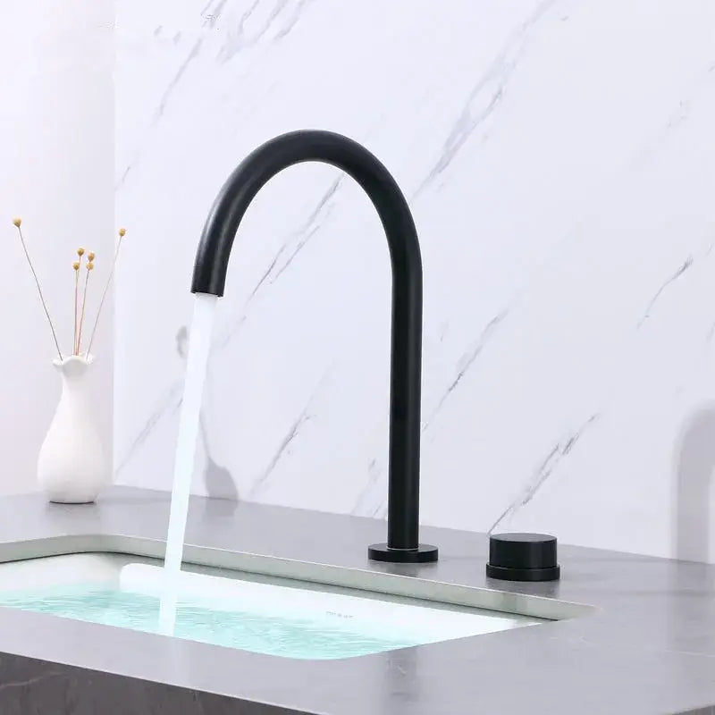 Modern brushed gold and black basin faucet with black matte finish and sleek curved spout by decorbites brushed gold