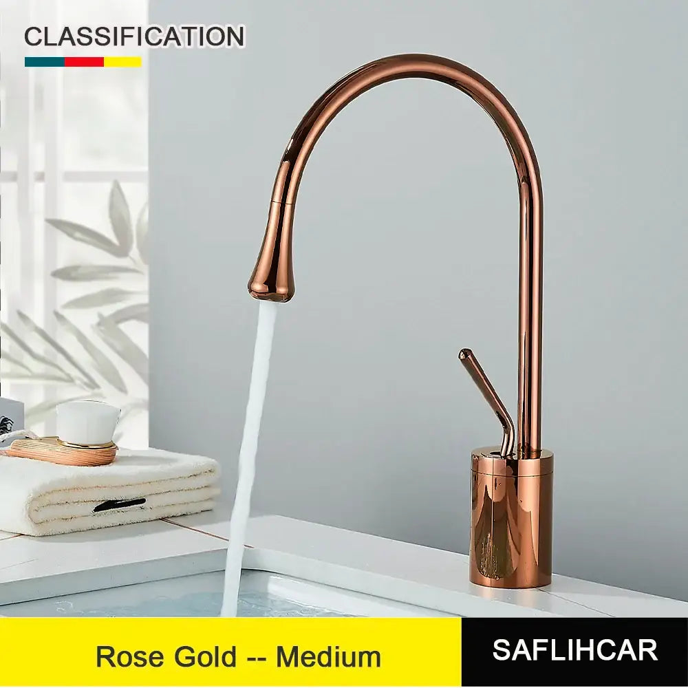 Modern brushed gold and black deck mounted single hole kitchen faucet with rose gold curved spout and cylindrical base
