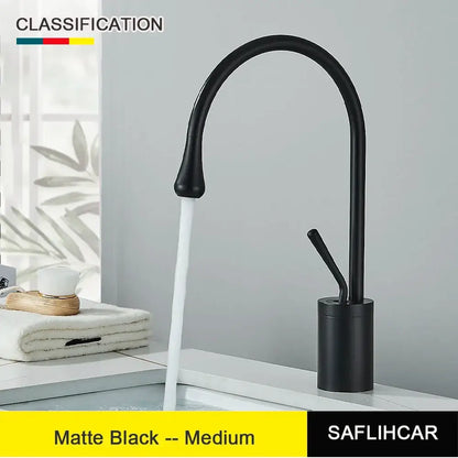 Modern brushed gold and black deck mounted single hole kitchen faucet with matte black curved spout and cylindrical base