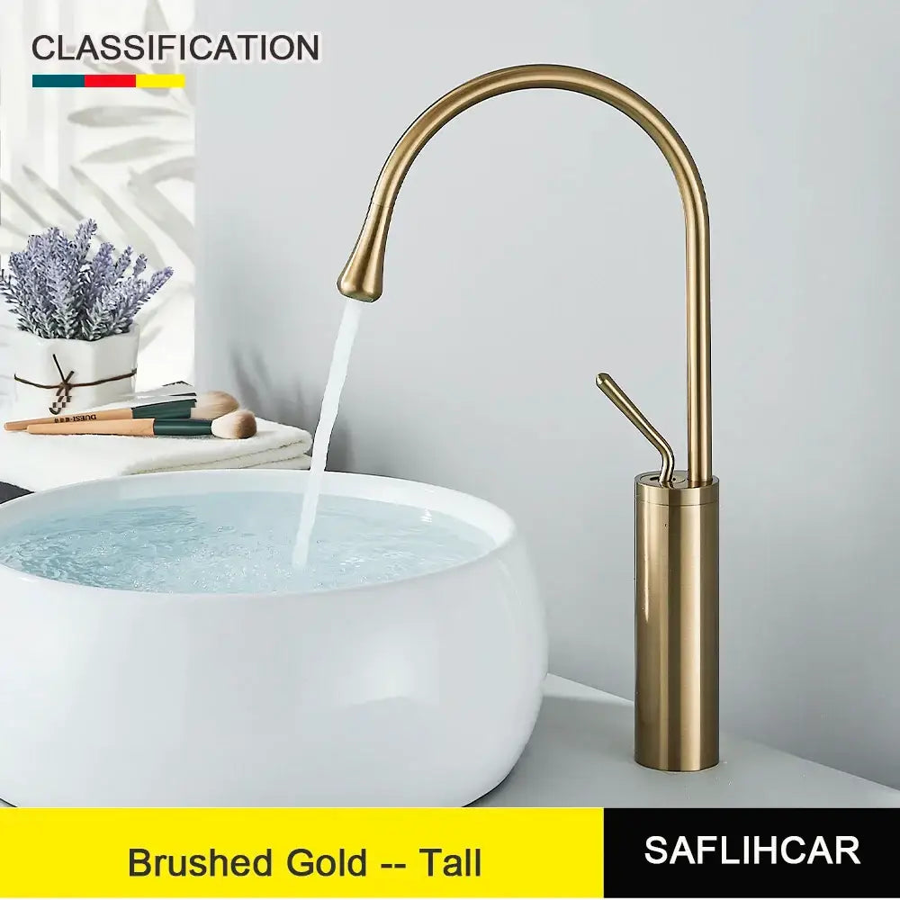 Modern brushed gold deck mounted tall kitchen basin tap with a sleek curved spout and cylindrical base single hole design