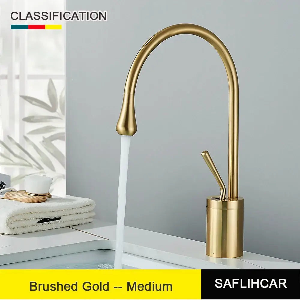 Modern brushed gold and black deck mounted kitchen faucet with single hole installation and sleek arched spout design