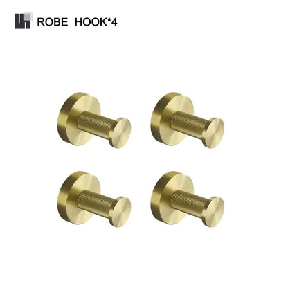 Set of four brass robe hooks with textured cylindrical design and polished brushed gold finish in bathroom accessories set