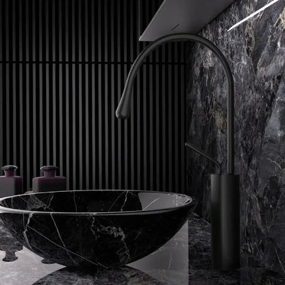 Black marble vessel sink with sleek curved matte black faucet and modern brushed gold brass kitchen sink tap