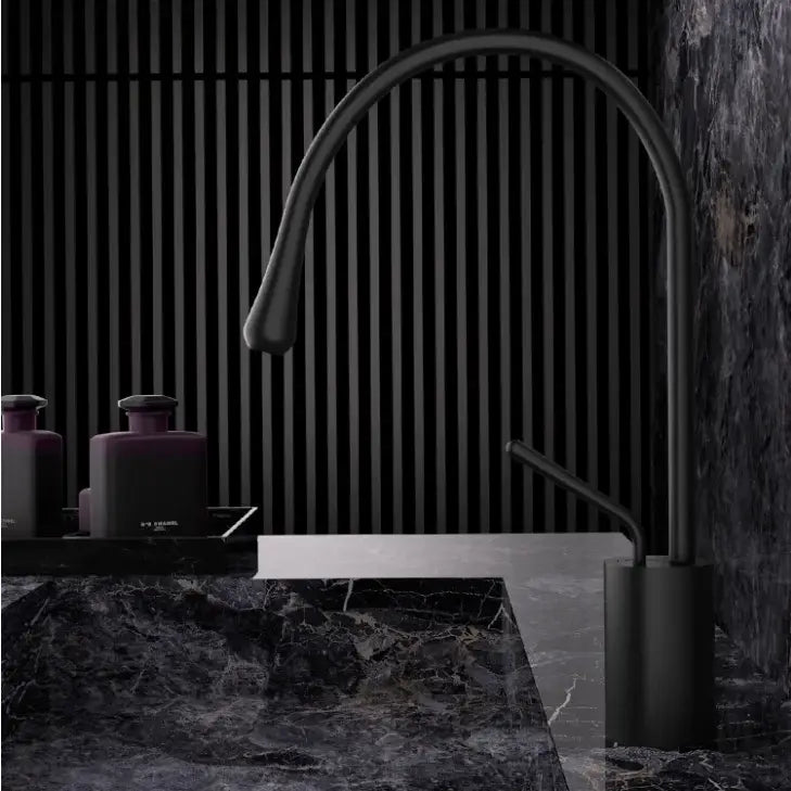 Black matte kitchen faucet with sleek curved spout and cylindrical base for modern brushed gold brass kitchen sink tap