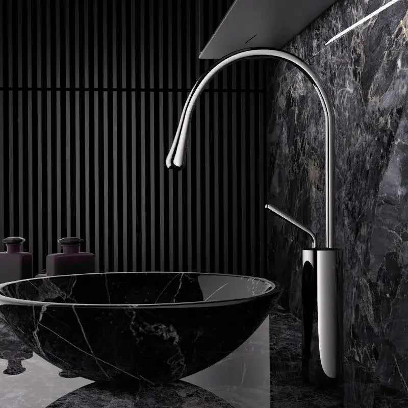 Modern chrome-finished kitchen sink faucet with sleek curved spout and minimalist design in brushed gold brass style