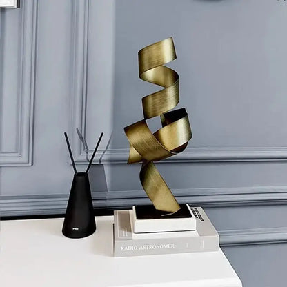 Modern brushed gold geometric wrought iron sculpture with a sleek spiral design for living room decor