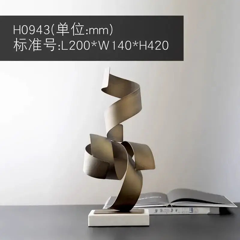A sleek modern brushed gold geometric wrought iron sculpture with a swirling ribbon design for living room decor