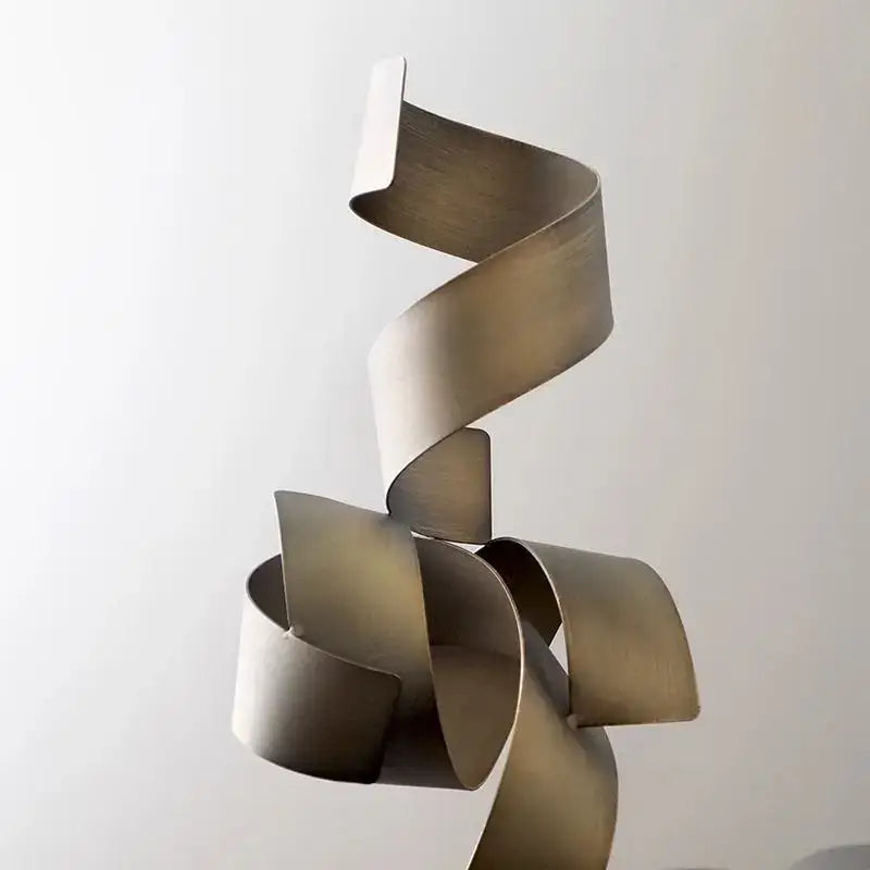 A sleek modern brushed gold geometric wrought iron sculpture with a continuous spiral design for living room decor