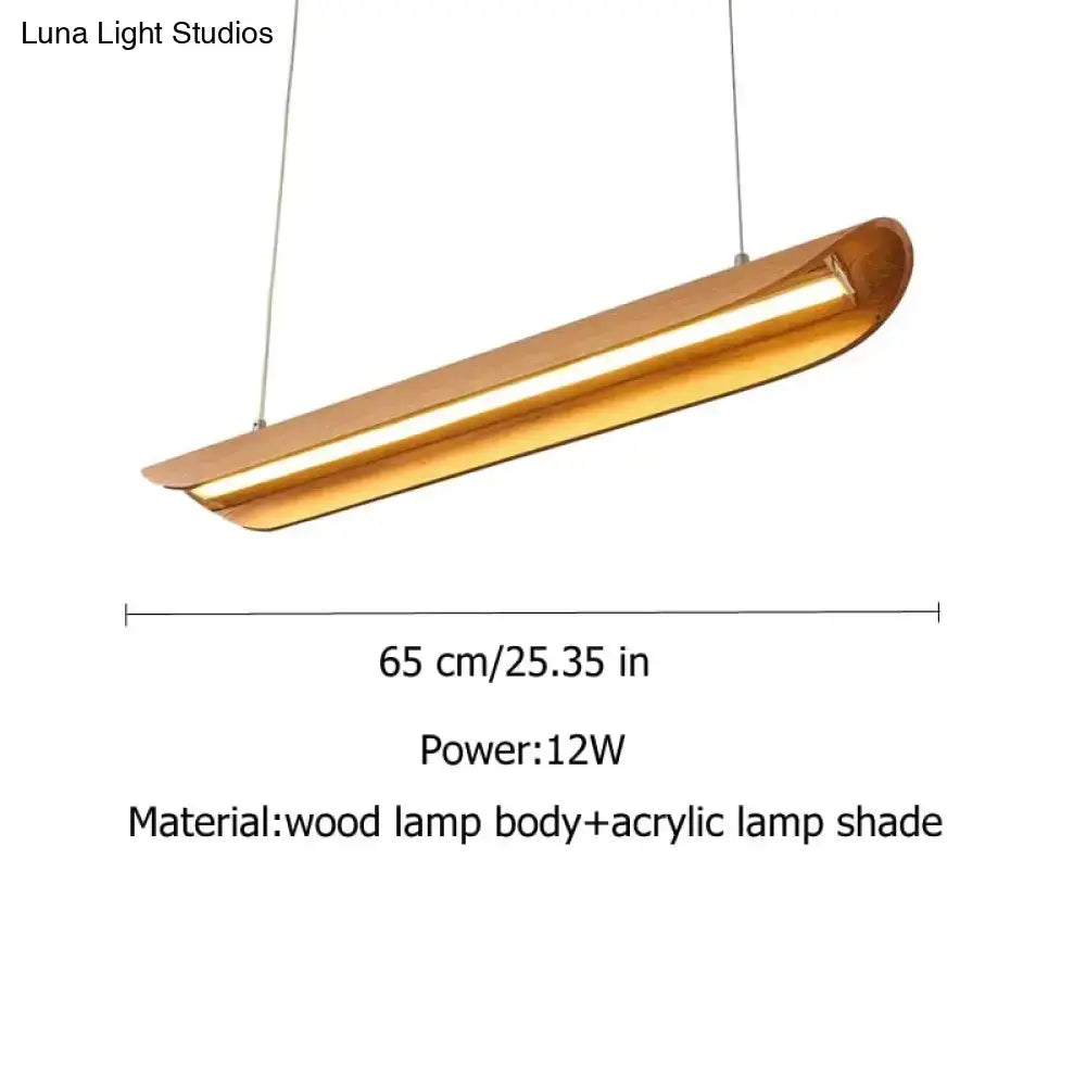 A modern brushed gold kitchen island light with a curved wooden body and acrylic shade for chandeliers kitchen island