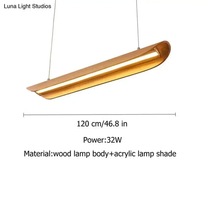 A sleek modern brushed gold kitchen island light with wooden body and acrylic shade for chandeliers kitchen island