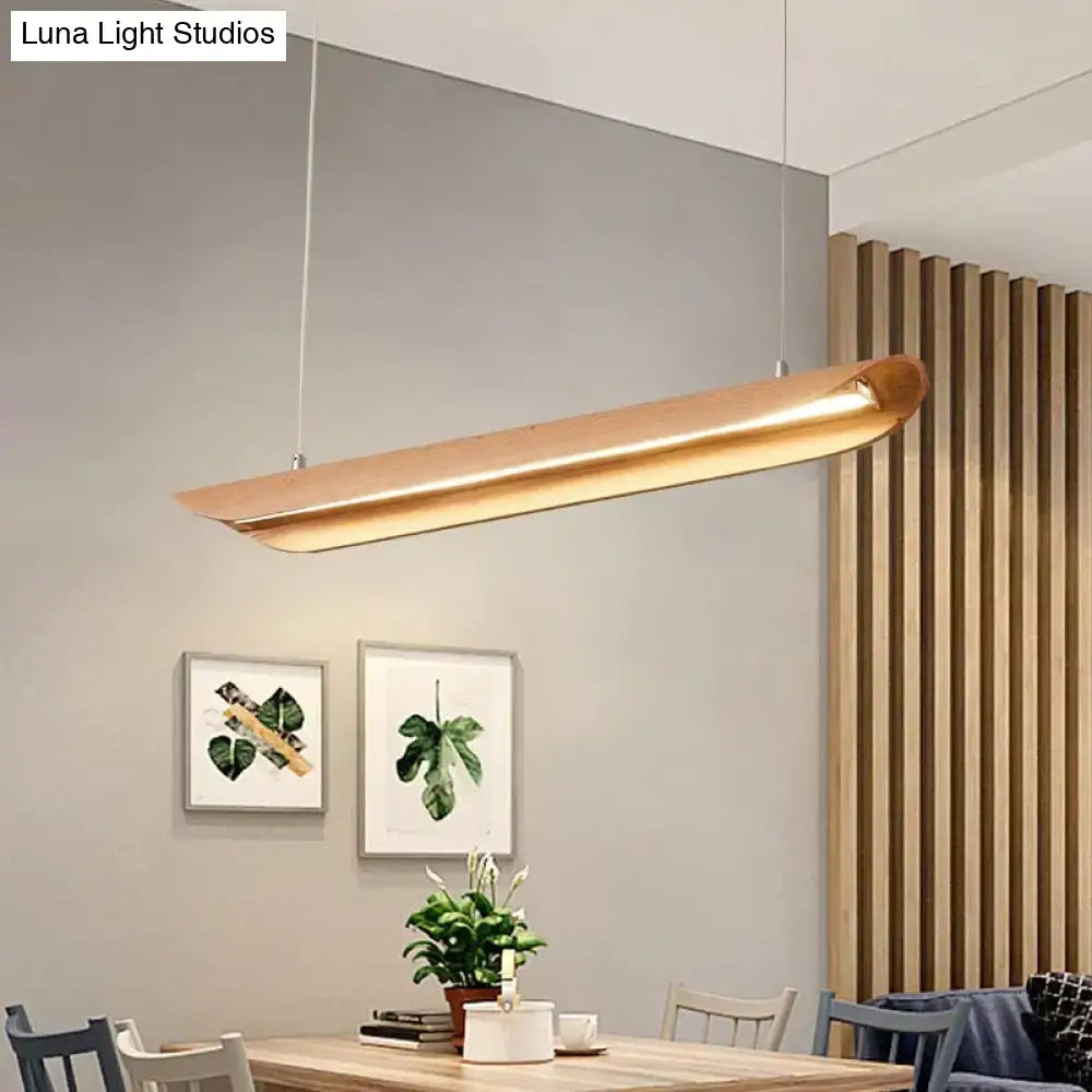A modern brushed gold kitchen island light fixture with brushed gold finish and minimalist design for chandeliers kitchen island