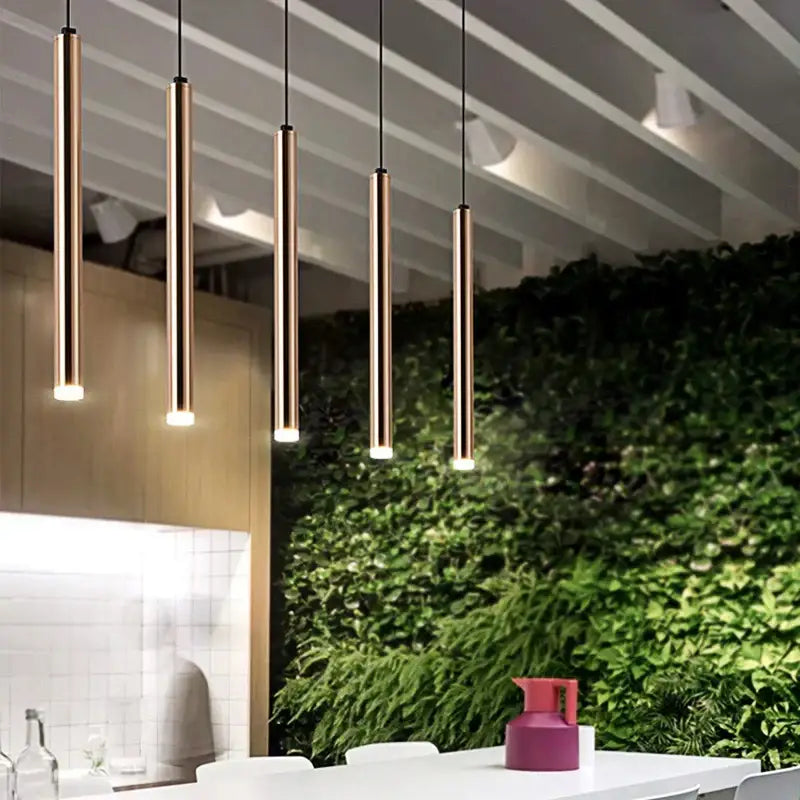 Five sleek cylindrical pendant lights with a warm brass finish for modern brushed gold led pendant decorbites gold led