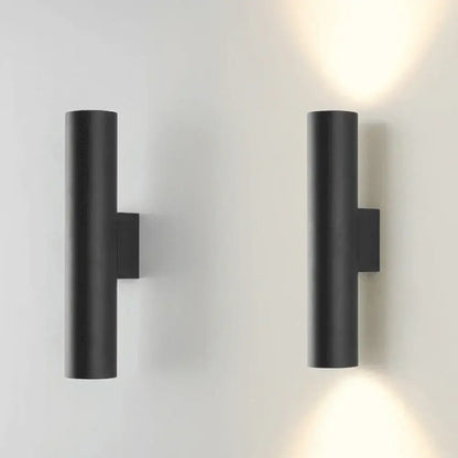 Modern brushed gold and matte black cylindrical wall lights featuring minimalist cylindrical wall lamps for bedroom lighting