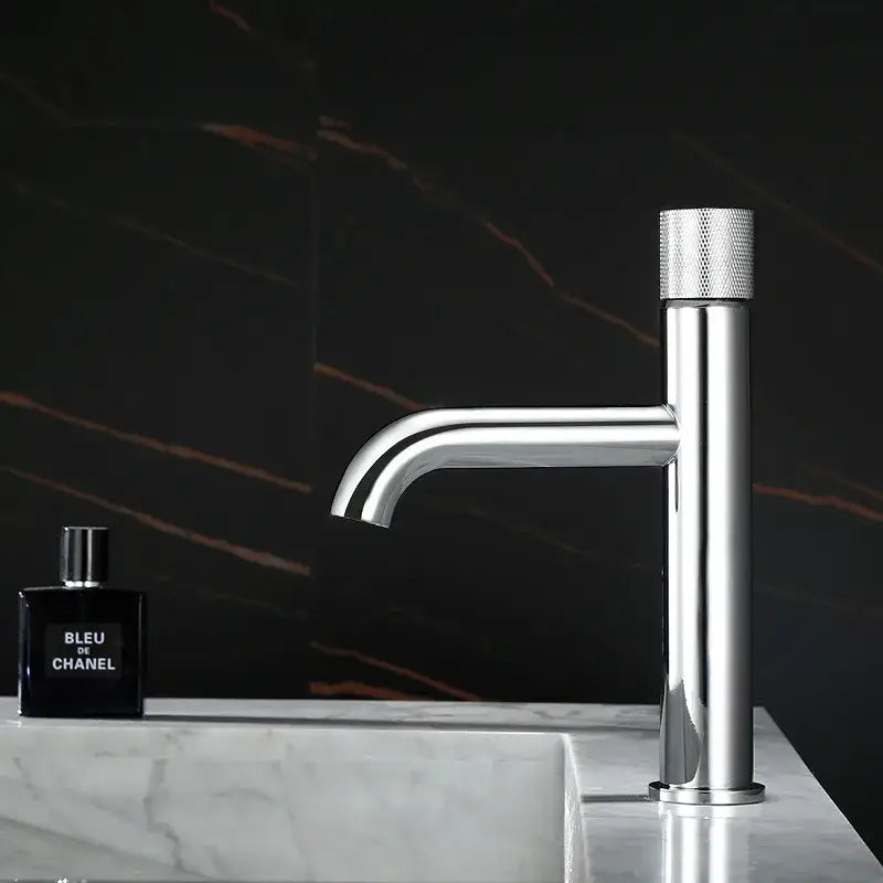 Modern brushed gold single handle basin faucet with chrome finish and textured knurled handle for bathroom use