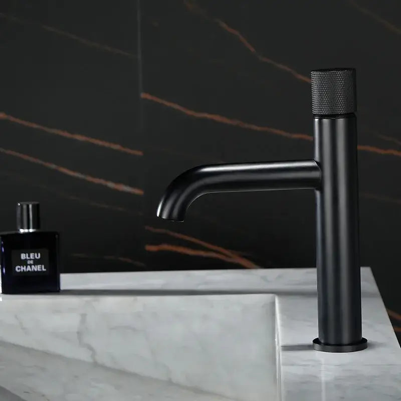 Black matte single handle basin faucet with textured knurled handle in modern brushed gold finish bathroom mixer