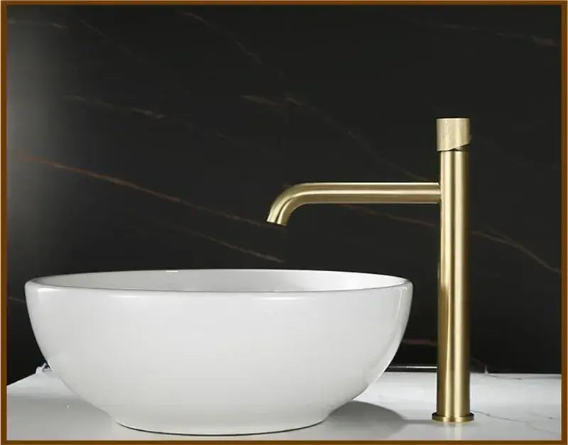 Modern brushed gold single handle basin faucet with knurled mixer and sleek minimalistic design for bathroom use