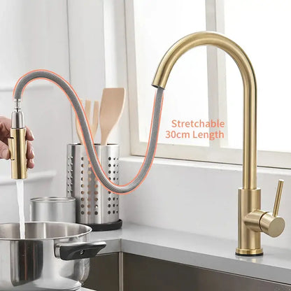 Modern brushed gold smart sensor kitchen faucet with dual outlet and flexible pull-down spray head in gold tone