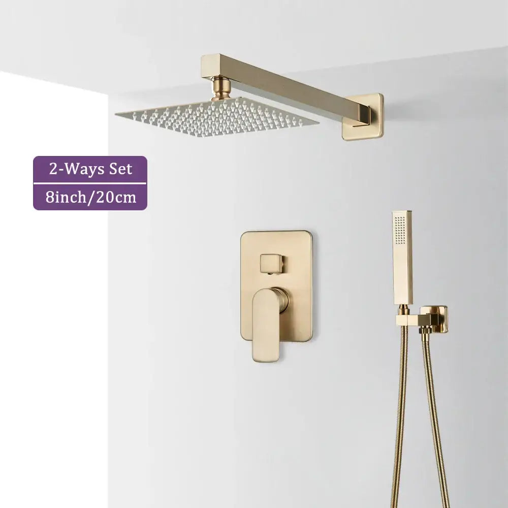 Modern brushed gold square shower faucet set with rainhead, wall-mounted valve, and handheld spray in sleek metallic design
