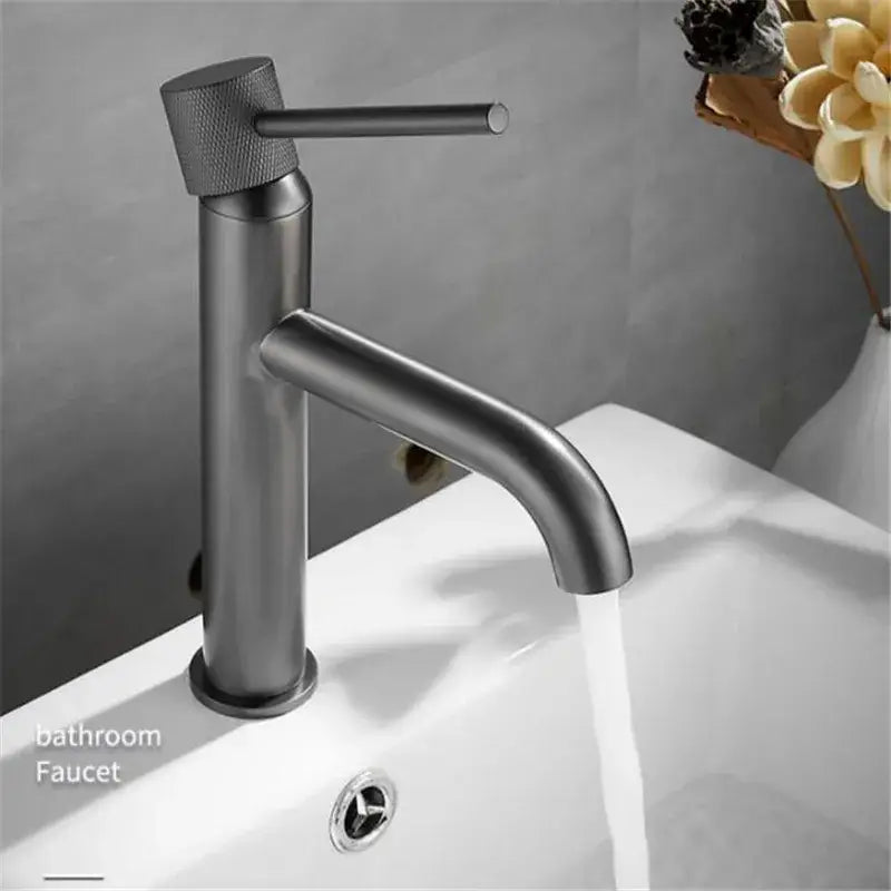 Modern matte black faucet with textured handle complementing brushed gold swivel bathroom basin sink crane decorbites brushed gold