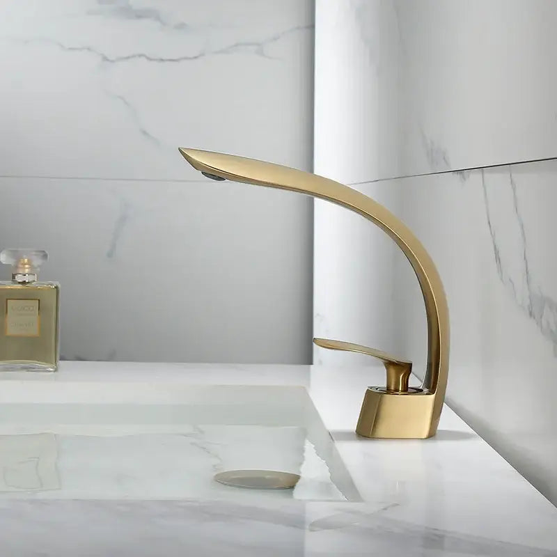 Modern brushed gold waterfall basin faucet by decorbites with sleek curved design and brushed gold basin finish
