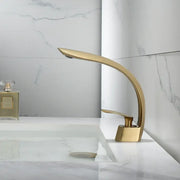 Modern brushed gold waterfall basin faucet with sleek curved design in decorbites brushed gold finish for bathroom use