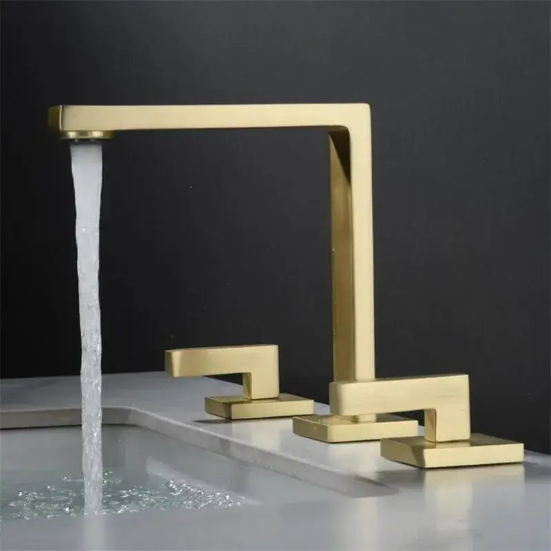 Modern brushed gold basin faucet with sleek angular design and three handles for bathroom sink decorbites brushed gold model
