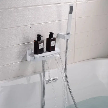 White wall-mounted shower shelf holding two black pump bottles beside modern brushed gold waterfall shower faucet set