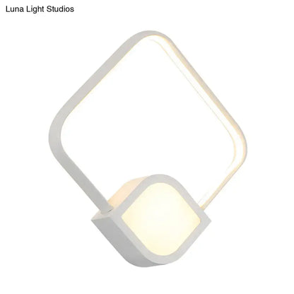 Modern brushed gold and white led wall sconce with geometric acrylic frame and maximum bulb wattage 15w for bedroom use