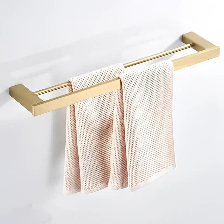 Modern brushed matt gold decorbites bath set gold-toned double-bar towel rack with two light beige textured towels
